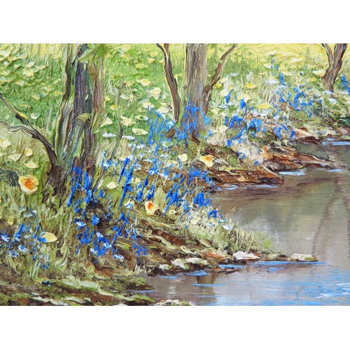 750 - Terry Evans b.1943, tranquil river scene with daffodils and bluebells, signed lower right, impasto o... 