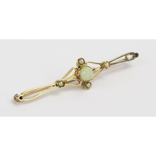 9 - A 15ct Gold, Opal and Seed Pearl Brooch, 55.7mm wide, stamped 15CT, 3.62g