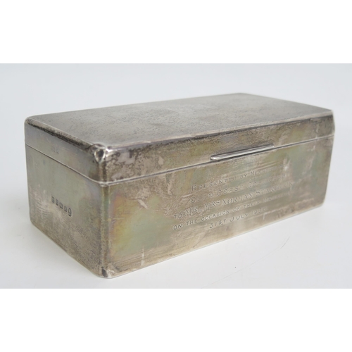 545 - A George V rectangular silver cigarette box, maker William Neale & Son Ltd, Birmingham, 1934, inscri... 