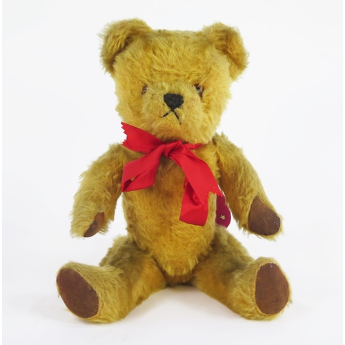 1276 - Vintage 1950's Musical Bear with blond mohair, glass eye, plays Jingle Bells, with handwrote tag sta... 