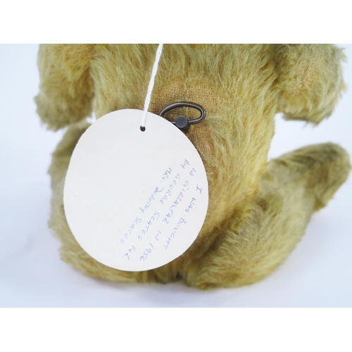 1276 - Vintage 1950's Musical Bear with blond mohair, glass eye, plays Jingle Bells, with handwrote tag sta... 