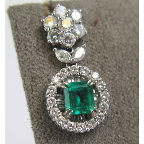 1 - A Pair of 18K White Gold, Emerald and Diamond Pendant Earrings with a top cluster above a suspended ... 