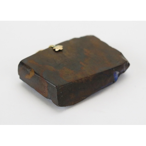 100 - A 9ct Gold Carved Bolder Opal Pendant decorated with a village scene, 41.3mm wide, stamped 375, 27.8... 