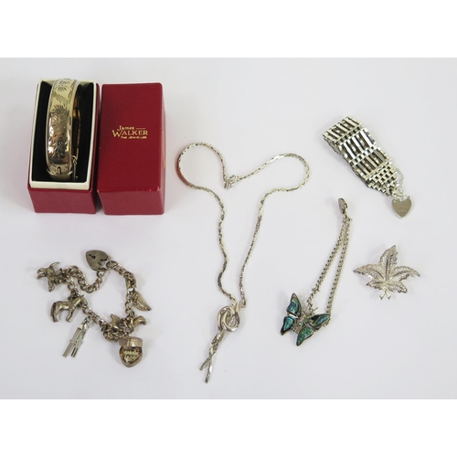 117 - A Boxed Silver Hinged Bangle with chased foliate decoration, silver charm bracelet, silver gate ling... 