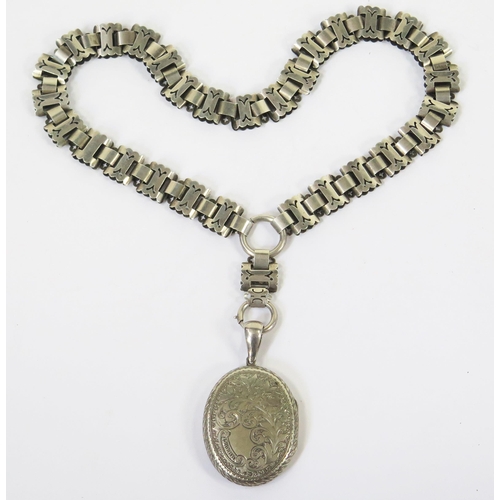 121 - A Victorian Precious White Metal Collar with pierced decoration (44cm) and a locket with chased foli... 