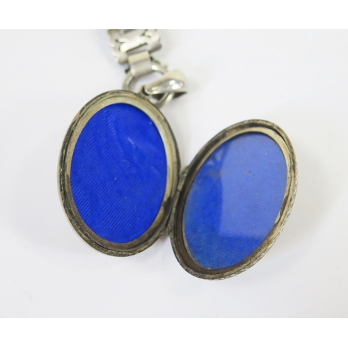 121 - A Victorian Precious White Metal Collar with pierced decoration (44cm) and a locket with chased foli... 