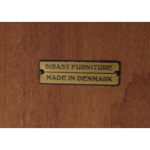 1339 - A Sibast Danish teak extending dining table, the rectangular top with two spare leaves, raised on tu... 