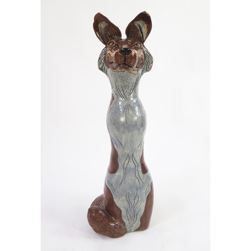 1342 - Jennie Hale (British 1956-) a large raku fired studio pottery sculpture of a seated wolf, signed to ... 