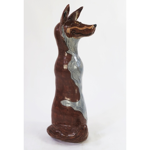 1342 - Jennie Hale (British 1956-) a large raku fired studio pottery sculpture of a seated wolf, signed to ... 