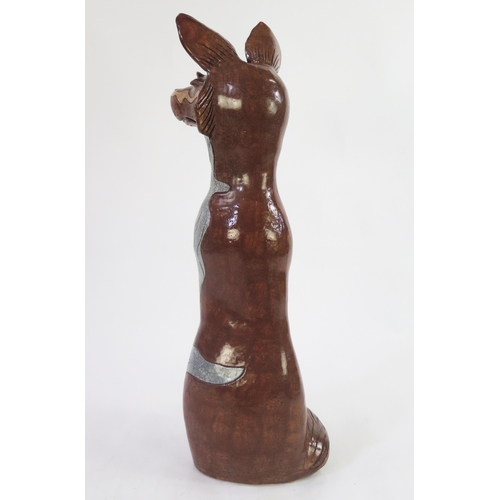 1342 - Jennie Hale (British 1956-) a large raku fired studio pottery sculpture of a seated wolf, signed to ... 