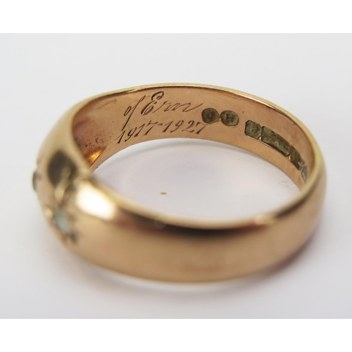 17 - An Antique 9ct Gold Three Stone Gypsy Ring with memorial inscription, size R.25, Birmingham 1917, 5.... 