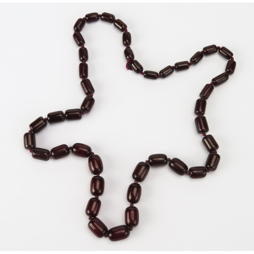 202 - A Faux Cherry Amber Bead Necklace, c. 80cm, largest bead c. 18.7x12.2mm, 59.94g