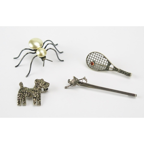 209 - A Precious White Metal and Marcasite Tennis Racket Brooch and three other silver brooches