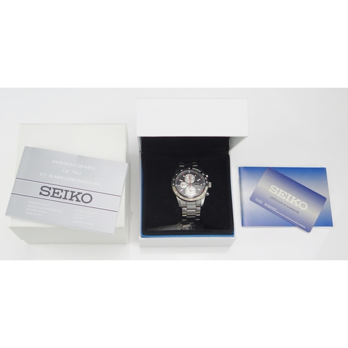 242 - A SEIKO Gent's Chronograph Wristwatch, cal. 7T52 with black, red and silver dial. Boxed and running