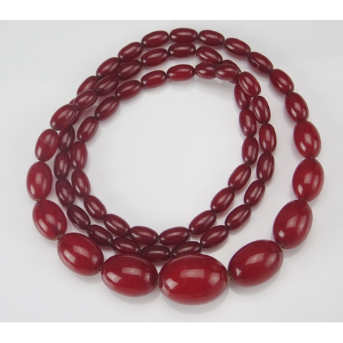 246 - A Faux Amber Graduated Bead Necklace, largest bead c. 29.5x21.5mm, 92cm, 67.5g