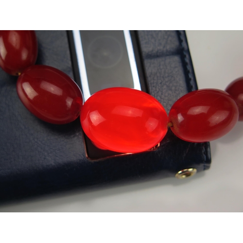 246 - A Faux Amber Graduated Bead Necklace, largest bead c. 29.5x21.5mm, 92cm, 67.5g