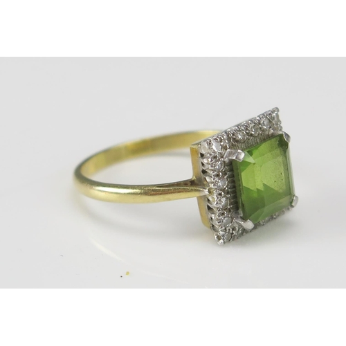 250 - An 18ct Gold, Peridot and Diamond Cluster Ring, c. 12.1mm head, size Q.5, stamped 18CT&PLAT, 5.51g