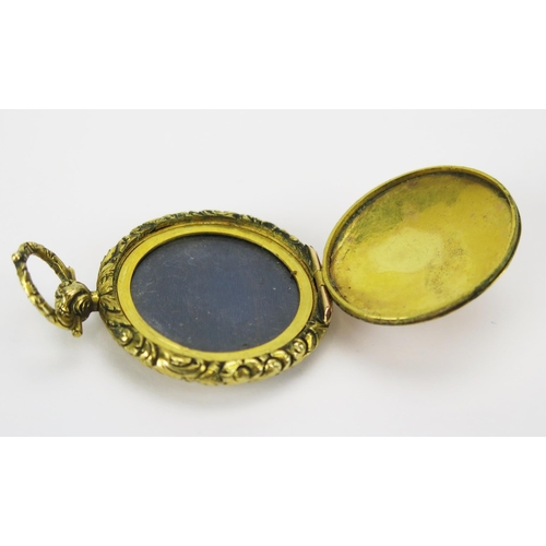 28 - An Antique Precious Yellow Metal Front and Back Locket with chased foliate scroll decoration, 31.8mm... 