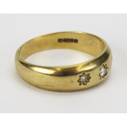 45 - An 9ct Gold and Diamond Three Stone Gypsy Ring, c. 2.35mm principal stone, size T, hallmarked, 5.08g
