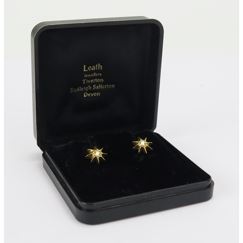 48 - A Diamond Eight Point Star Studs in a precious yellow metal setting, 10.3mm diam., c. 2.45mm stones,... 