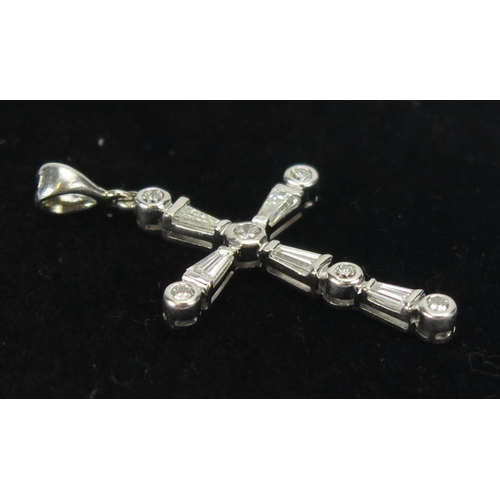 51 - An 18ct White Gold and Diamond Set Cross Pendant with brilliant round and baguette cuts, 39.5mm drop... 