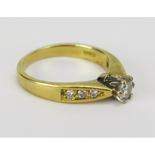54 - An 18ct Gold and Diamond Ring, c. 3.95mm brilliant round cut principal stone set with a further thre... 