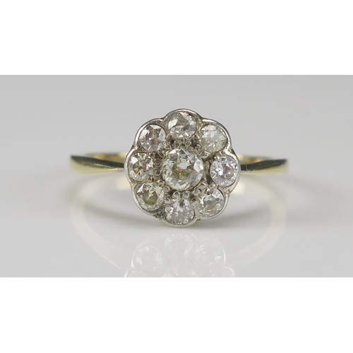61 - An Old Cut Diamond Cluster Ring in a precious yellow metal setting, 10.5mm head, size P.5, rubbed ma... 