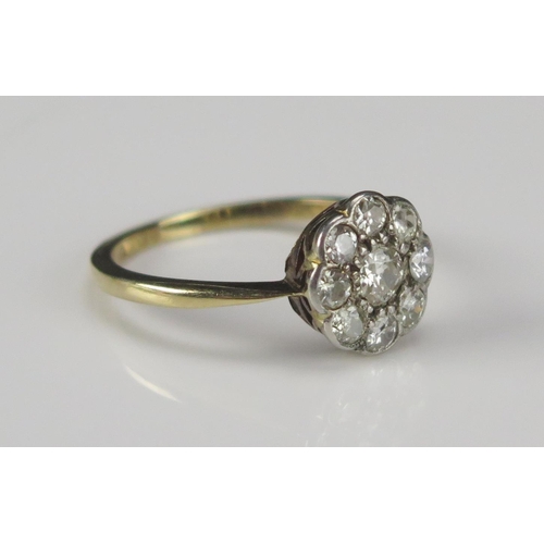 61 - An Old Cut Diamond Cluster Ring in a precious yellow metal setting, 10.5mm head, size P.5, rubbed ma... 