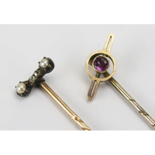 70 - A 9ct Gold Stick Pin with red stone (stamped 9CT) and one other precious yellow metal stick pin with... 