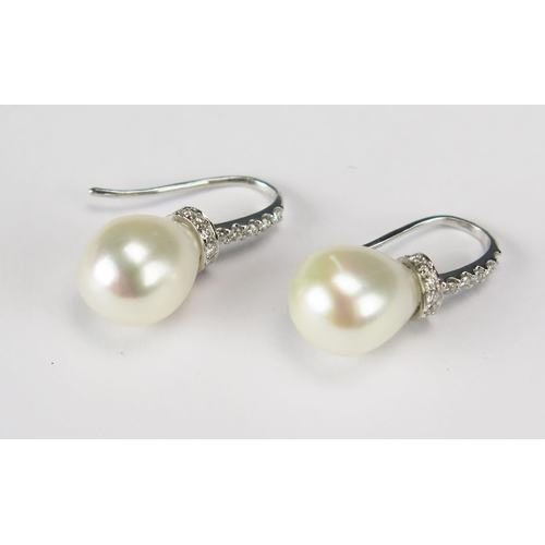 77 - A Pair of High Carat Precious White Metal, Cultured Pearl and Diamond Pendant Earrings with fishhook... 