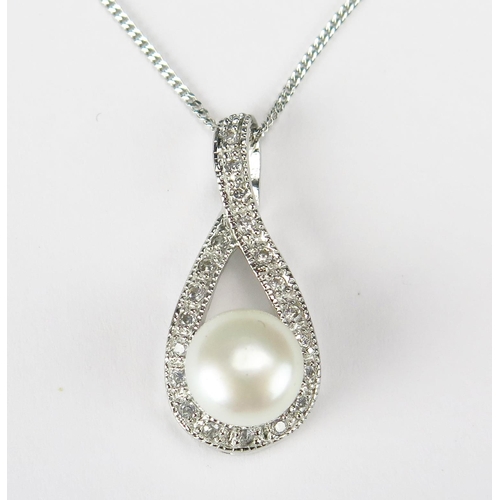 79 - A Silver Pear Shaped Pendant set with cultured pearl and cubic zirconia on a silver chain