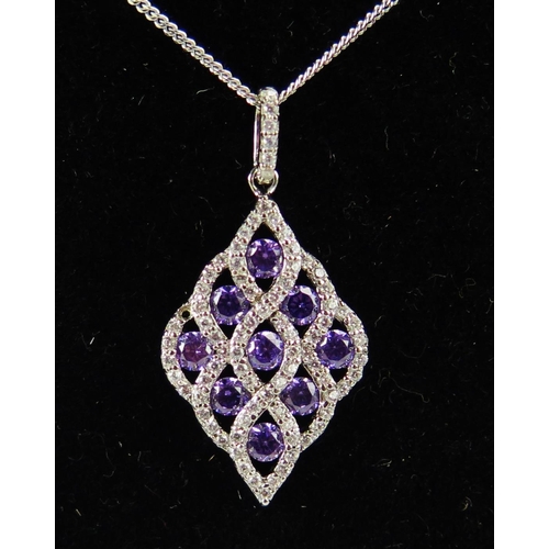 80 - A Silver Pendant set with purple and white cubic zirconia on a silver chain