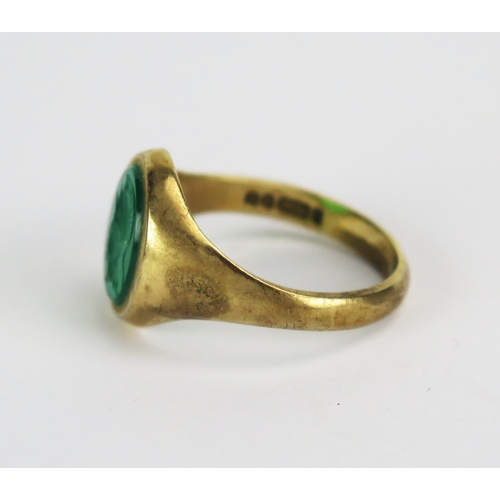 13 - Gent's 9ct Gold Signet Ring set with a green paste decorated with a classical helmed soldier in prof... 