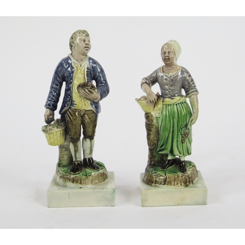 1532 - A pair of early 19th century Staffordshire pearlware figures of fruit pickers, 18cm and 16.5cm high ... 