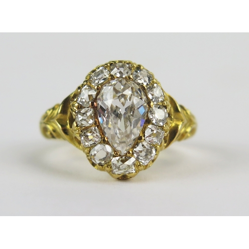 Georgian Diamond Ring set in 18th yellow gold with scroll decoration to the shoulders, c. 8.55x5.55mm principal pear cut stone, 13.5x11.3mm head, size I, stamped 18 JM, 4.47g