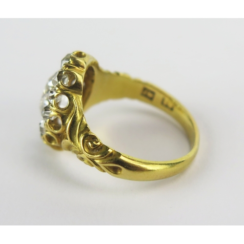331 - Georgian Diamond Ring set in 18th yellow gold with scroll decoration to the shoulders, c. 8.55x5.55m... 