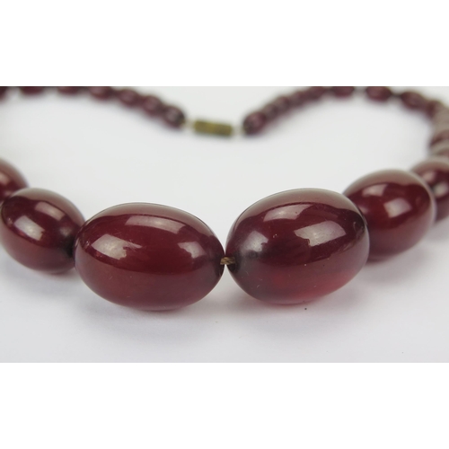35 - Faux Cherry Amber Bead Necklace, c. 24.45x17.48mm largest bead, 50cm, 41.41g