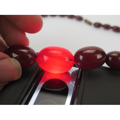 35 - Faux Cherry Amber Bead Necklace, c. 24.45x17.48mm largest bead, 50cm, 41.41g