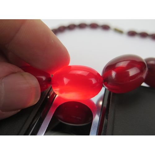 35 - Faux Cherry Amber Bead Necklace, c. 24.45x17.48mm largest bead, 50cm, 41.41g