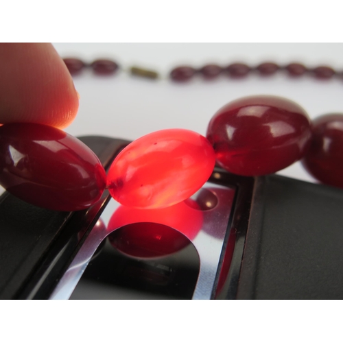 35 - Faux Cherry Amber Bead Necklace, c. 24.45x17.48mm largest bead, 50cm, 41.41g