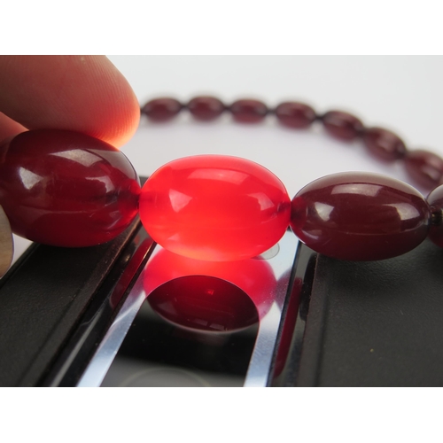 35 - Faux Cherry Amber Bead Necklace, c. 24.45x17.48mm largest bead, 50cm, 41.41g