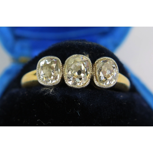3 - Antique diamond three stone ring in an 18ct yellow gold and millegrain platinum setting, principal o... 