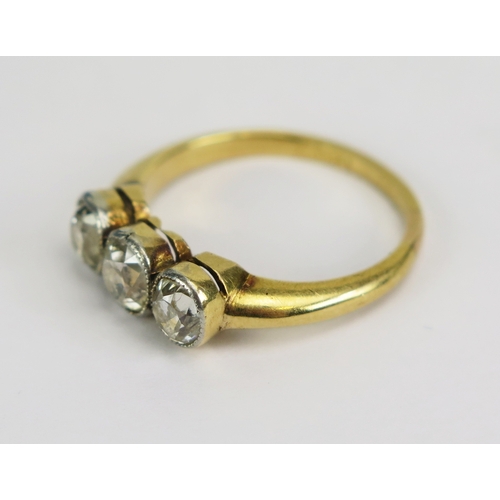 3 - Antique diamond three stone ring in an 18ct yellow gold and millegrain platinum setting, principal o... 