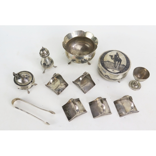 322 - A collection of assorted Egyptian silver and niello inlaid wares includes condiments, napkin holders... 