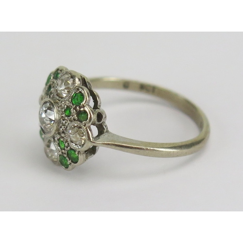 33 - 9ct white gold, diamond and emerald cluster ring, c. 39mm principal rub over set stone, 12.5mm head,... 