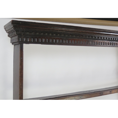 An 18th century oak dresser, The upper plate rack with dentil moulded ...