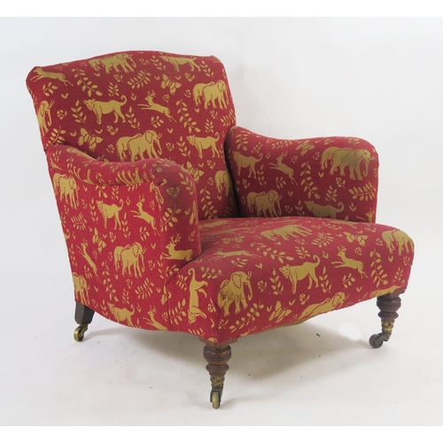 Howard & Sons Ltd., Berners St., a late 19th century armchair, later fully upholstered, with padded back, padded armrests and stuff over seat, raised on ring turned front supports terminating in brass castors also stamped Howard & Sons Ltd., the back leg also stamped together with a serial number 247382, 70cm wide, 82cm high, 98cm deep