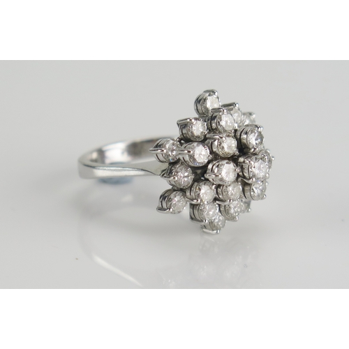 46 - 14K white gold and diamond cluster ring set with 25 brilliant round cuts ranging from c. 3.1-3.4mm, ... 