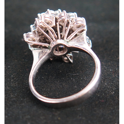 46 - 14K white gold and diamond cluster ring set with 25 brilliant round cuts ranging from c. 3.1-3.4mm, ... 