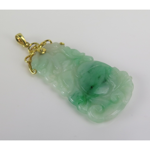 108 - A Chinese carved jade pendant decorated with gourds, 53mm drop, 6.85g